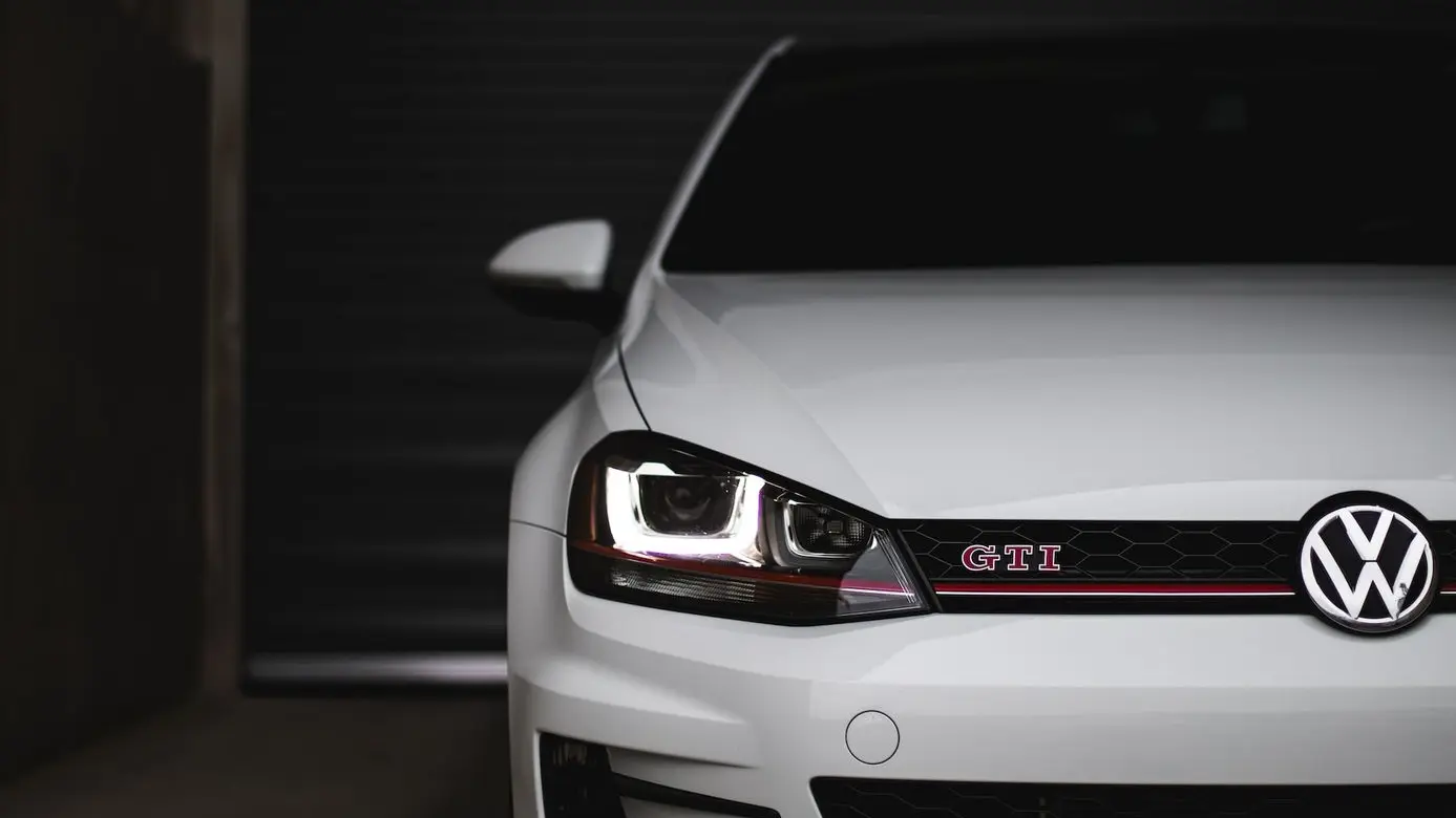 white bmw m 3 parked in garage